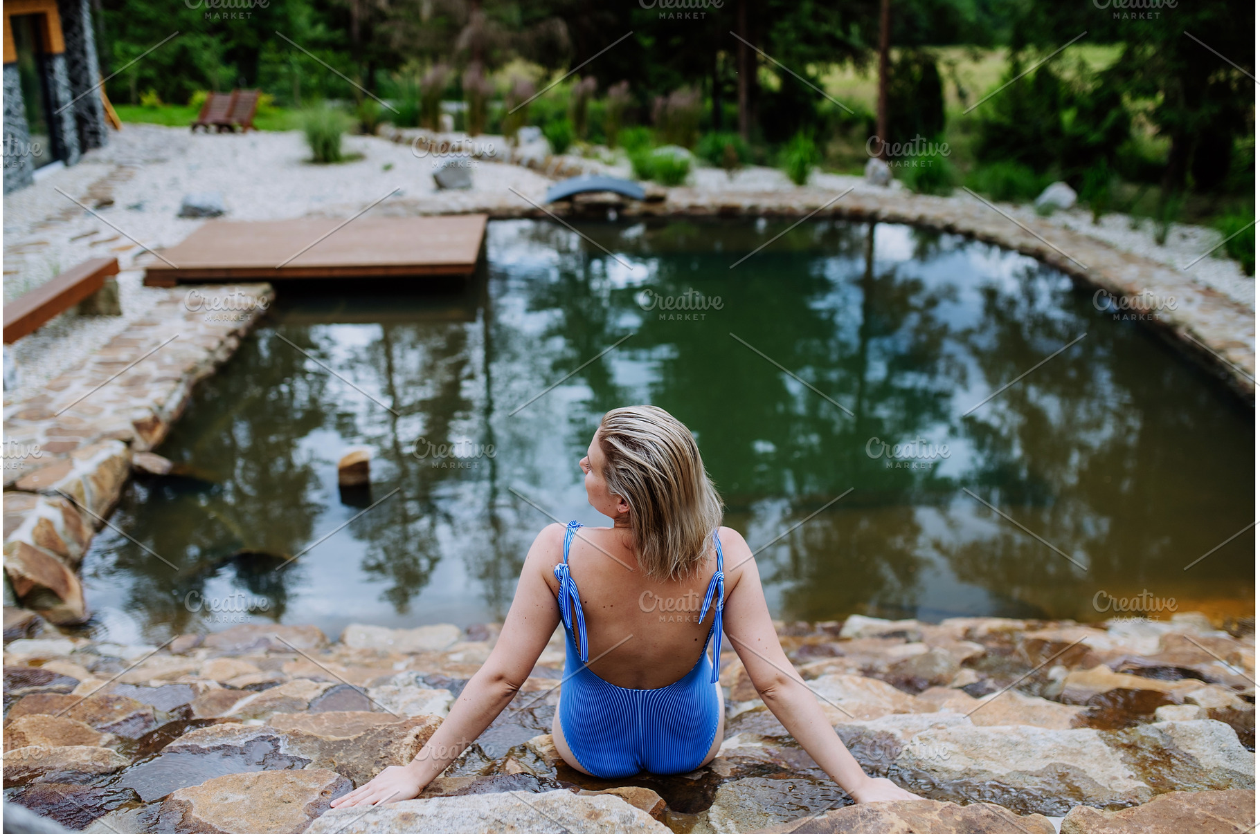 Rear view of young woman in swimsuit, a Nature Photo by HalfPoint