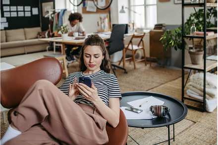 Young woman having break at work, a Person Photo by HalfPoint