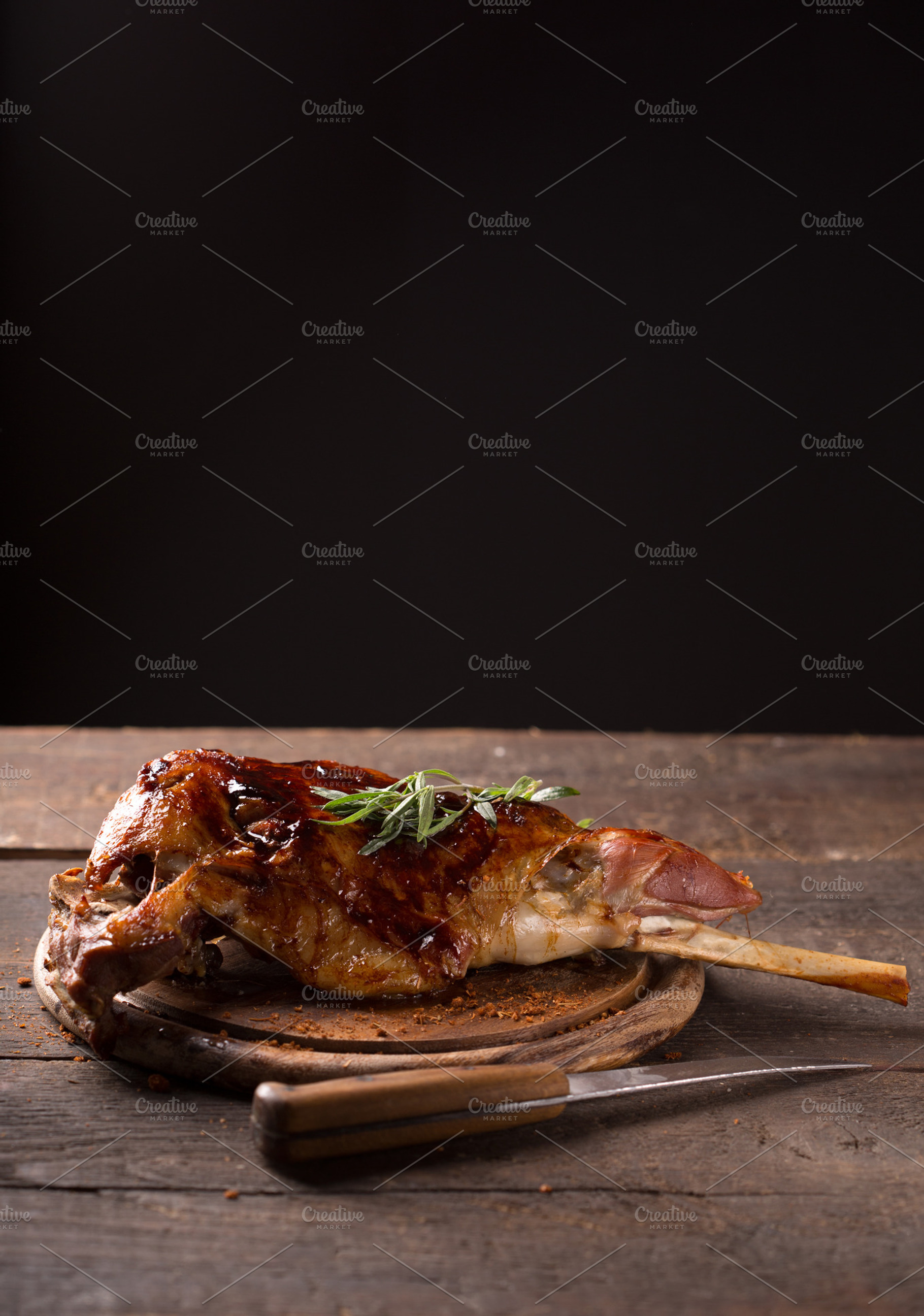 Roasted lamb leg stock photo containing animal and bone, a Food & Drink Photo by peterzsuzsa