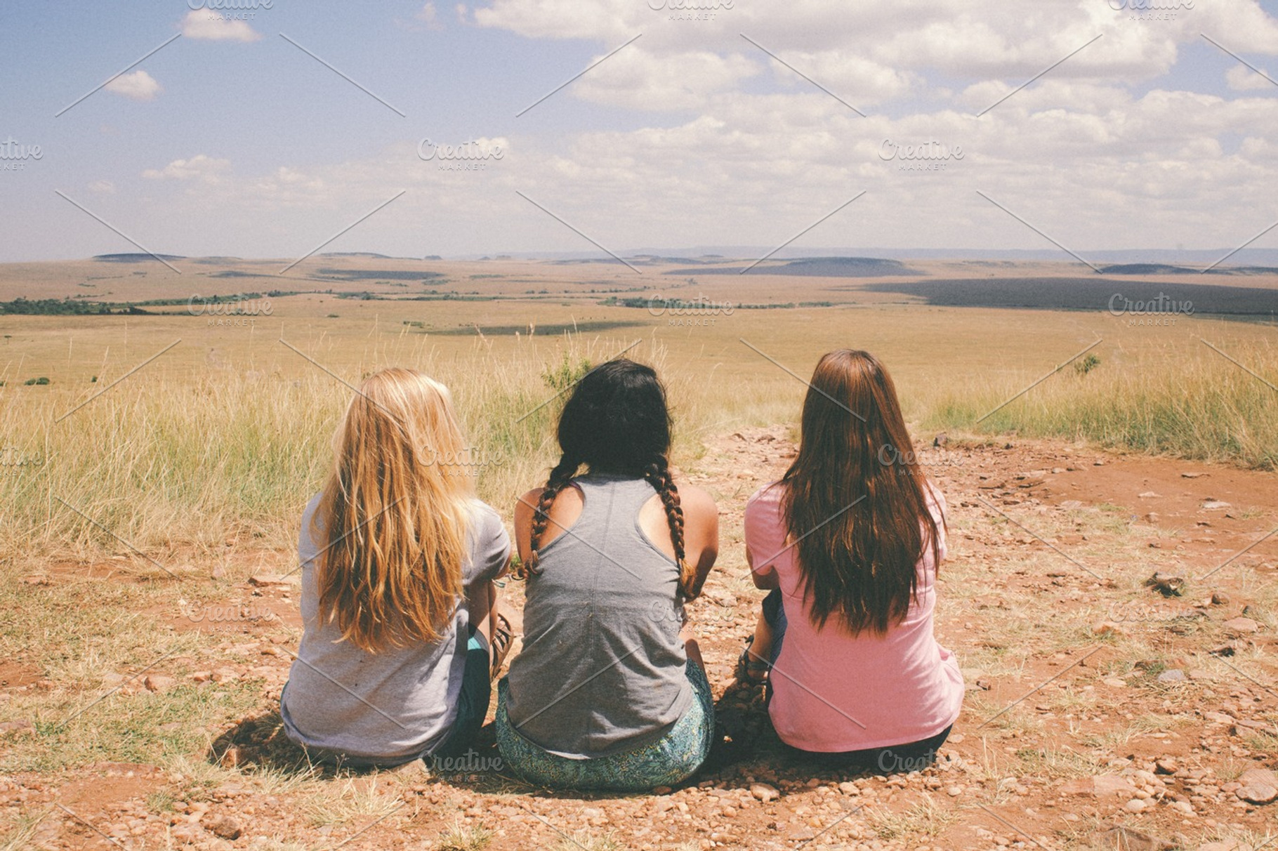 Three Girls Sitting in the Desert, a Person Photo by wesbeale