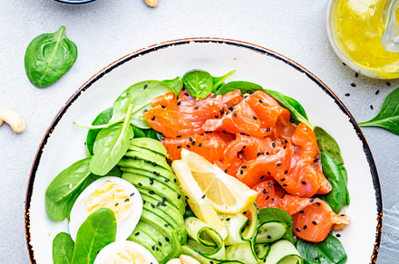 Ketogenic salad with salted salmon, avocado, spinach, cucumber,, a Food & Drink Photo by 5PH