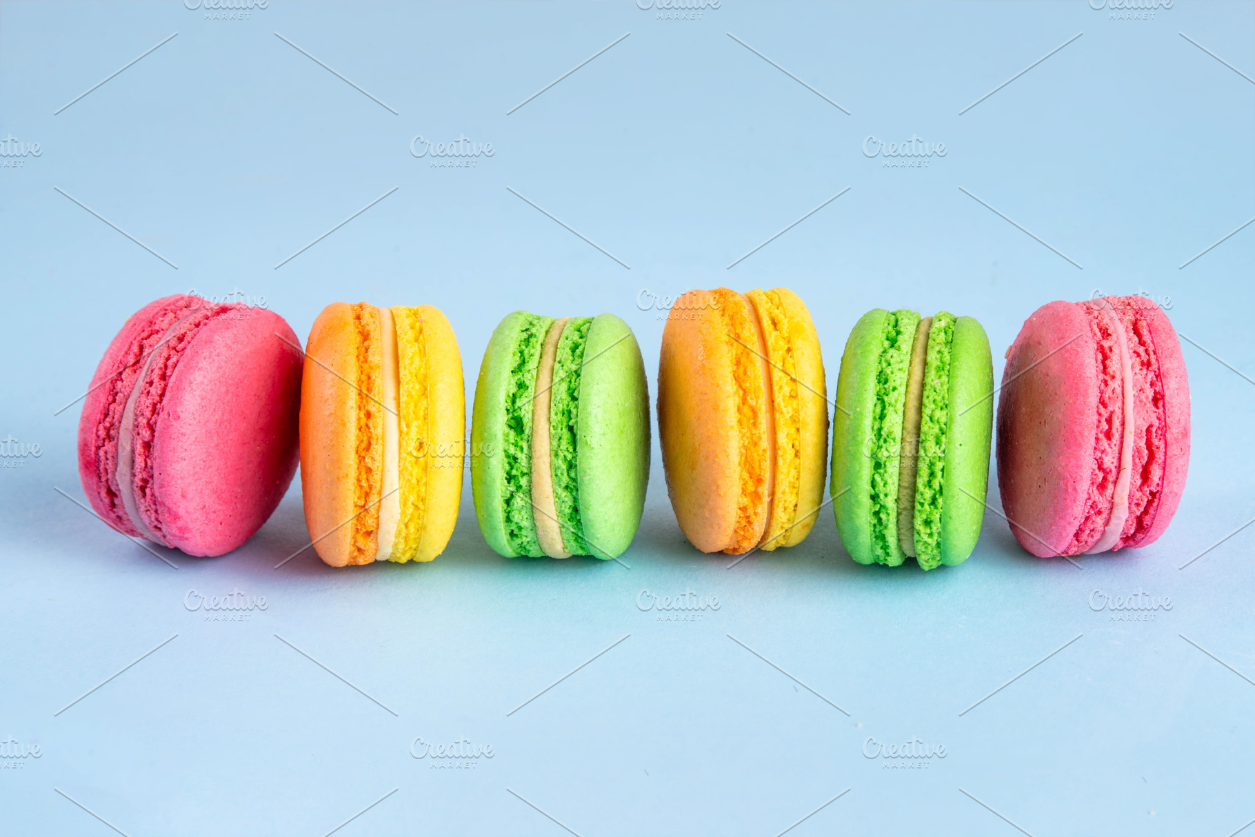 Bright and colorful sweet macaroons  dessert with fresh berries, a Food & Drink Photo by Rimma