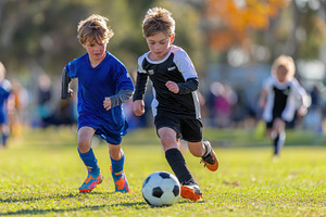 Young soccer players compete intense, a Photo by Pixeness Studio
