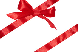 Tied bow made of red silk ribbon on an isolated background, deco, a Holiday Photo by ndanko