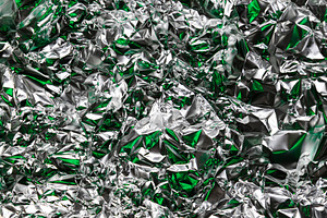 Crumpled foil with silver and green, a Background Photo by Edalin's Store