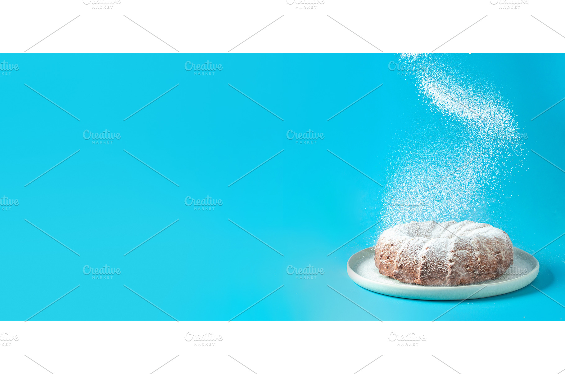 Icing sugar falling on bundt cake, a Food & Drink Photo by Fascinadora