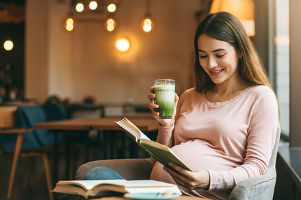 Pregnant woman reading a book