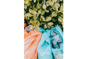 orange blue and gray plastic trash, an Abstract Photo by Lermont51