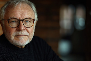 Wise elderly man with white beard and round glasses wearing blac, a Person Photo by José Manuel Gelpi