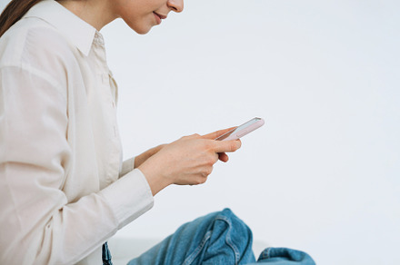 Young woman with mobile at home, a Person Photo by Galina_Zhigalova