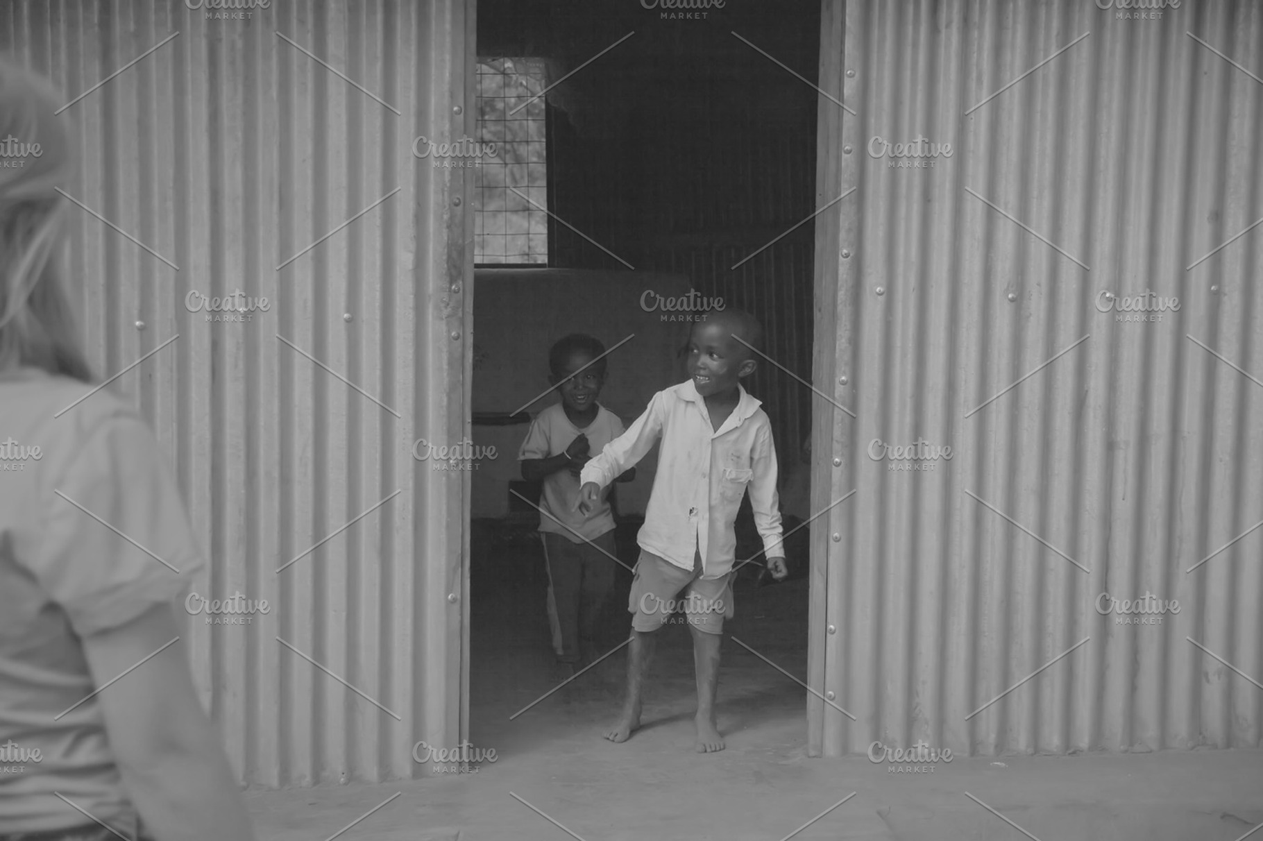 Boy Coming out of House