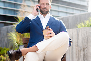 Businessman talking on phone during coffee breakDescription:, a Business Photo by etorres69