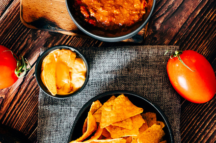 Mexican nachos with guacamole, cheddar cheese and chili.