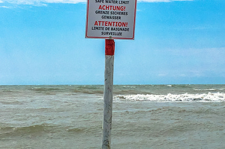 Information sign for swimmers, a Nature Photo by KYNA STUDIO