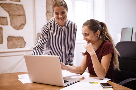 Young business team working together stock photo containing laptop and