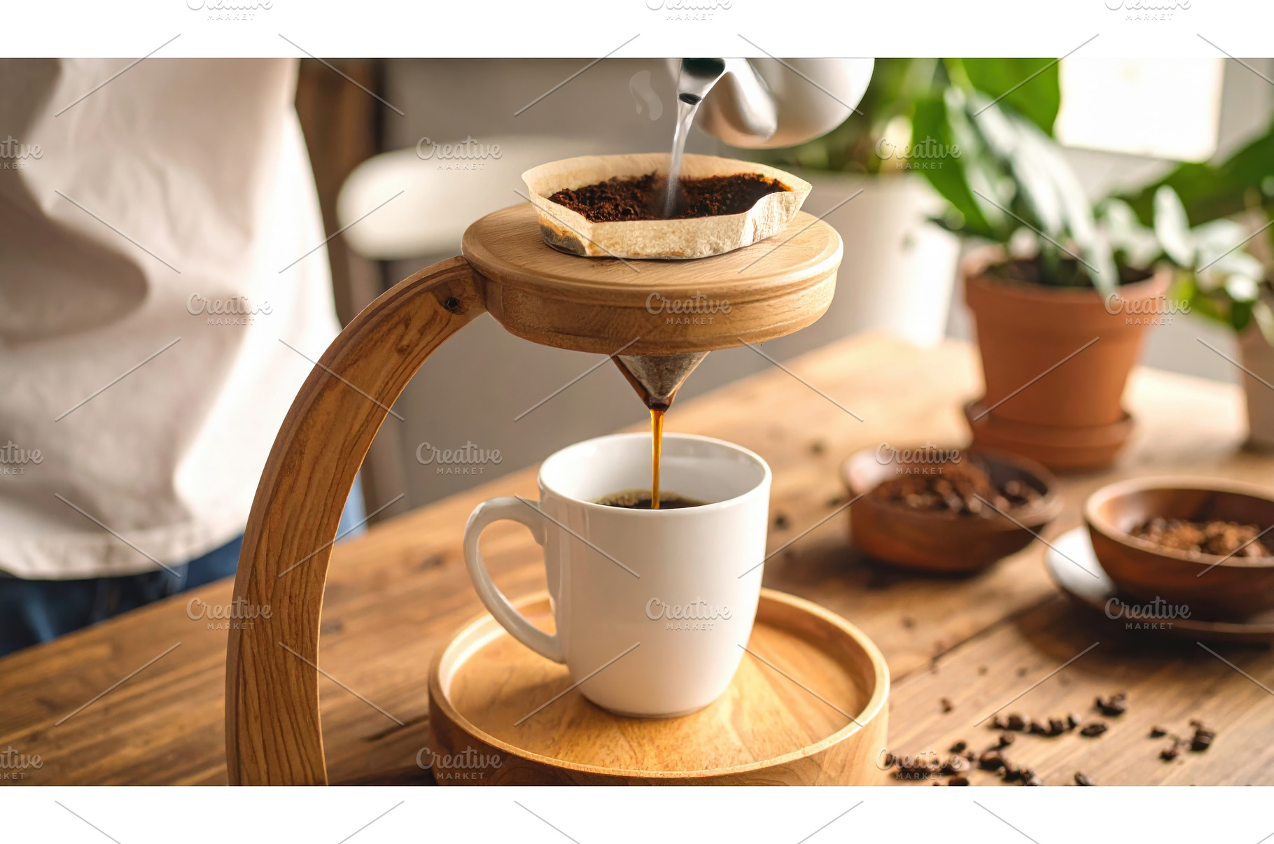 A handcrafted wooden coffee dripper, a Food & Drink Photo by Igor Tichonow