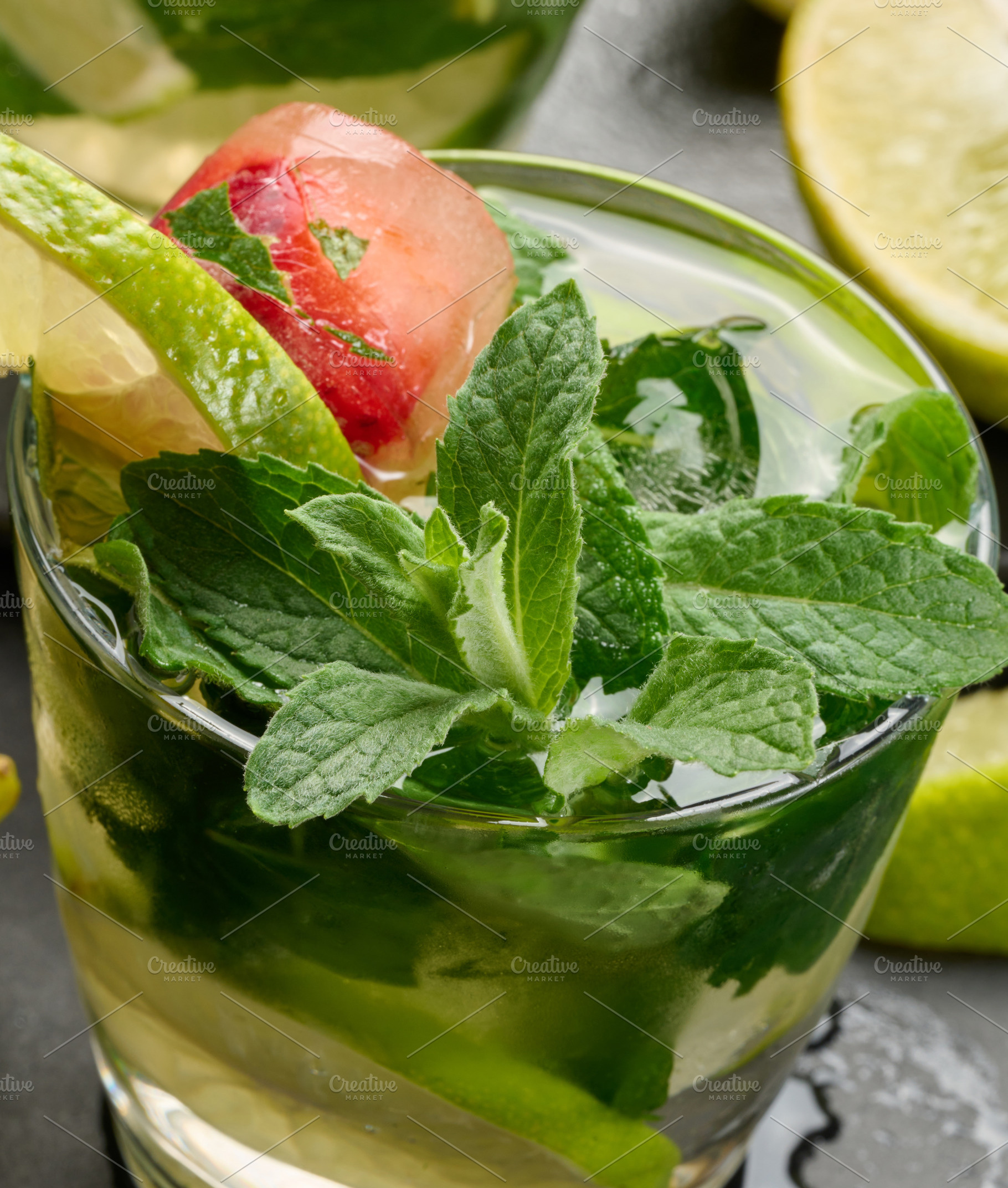 Refreshing mojito cocktail with lime, mint, strawberry, and ice, a Food & Drink Photo by ndanko