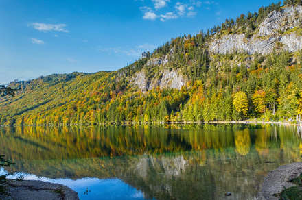 Peaceful autumn Alps mountain lake with clear transparent water, a Nature Photo by YuriyB