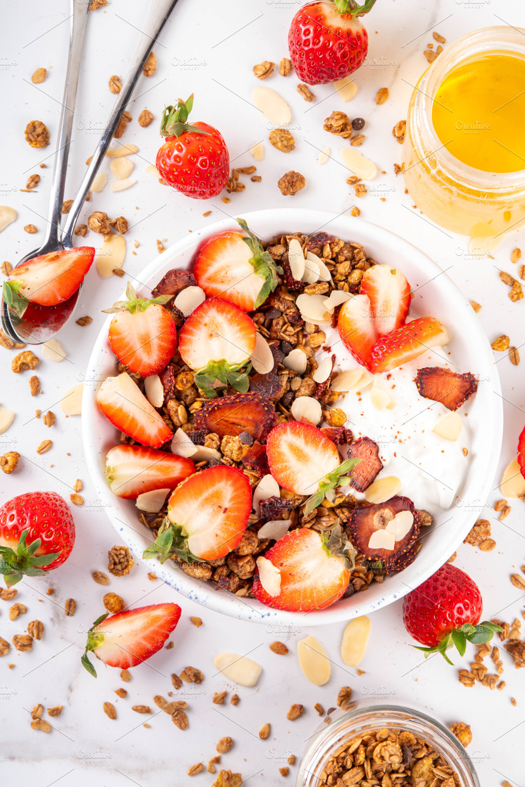 Healthy breakfast bowl with granola, yogurt and strawberry, a Food & Drink Photo by Rimma