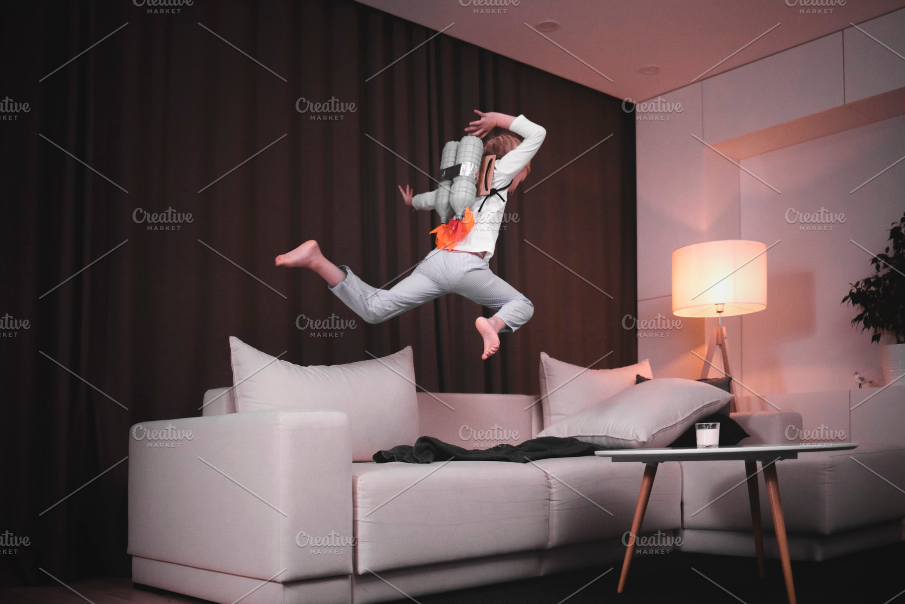 From sofa to space containing girl, cute, and little, a Person Photo by supamotion