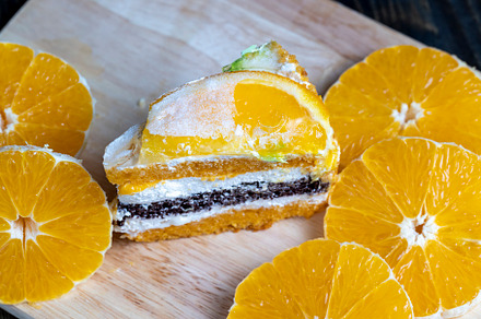 sliced fresh oranges and a piece of orange dessert, a Food & Drink Photo by MyPhotos