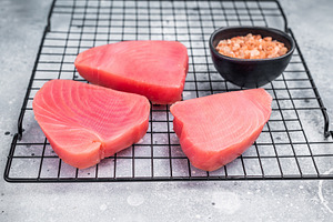 Premium raw tuna fillet steak, ideal for grilling or sashimi, a, a Food & Drink Photo by composter-box@mail.ru