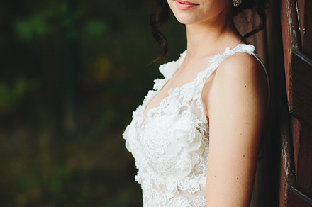 Bride poses for the camera containing bride, wedding, and white, a Person Photo by Tekso