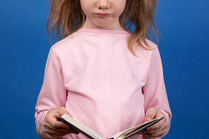 Serious Girl Reading Book, a Person Photo by Ales Munt