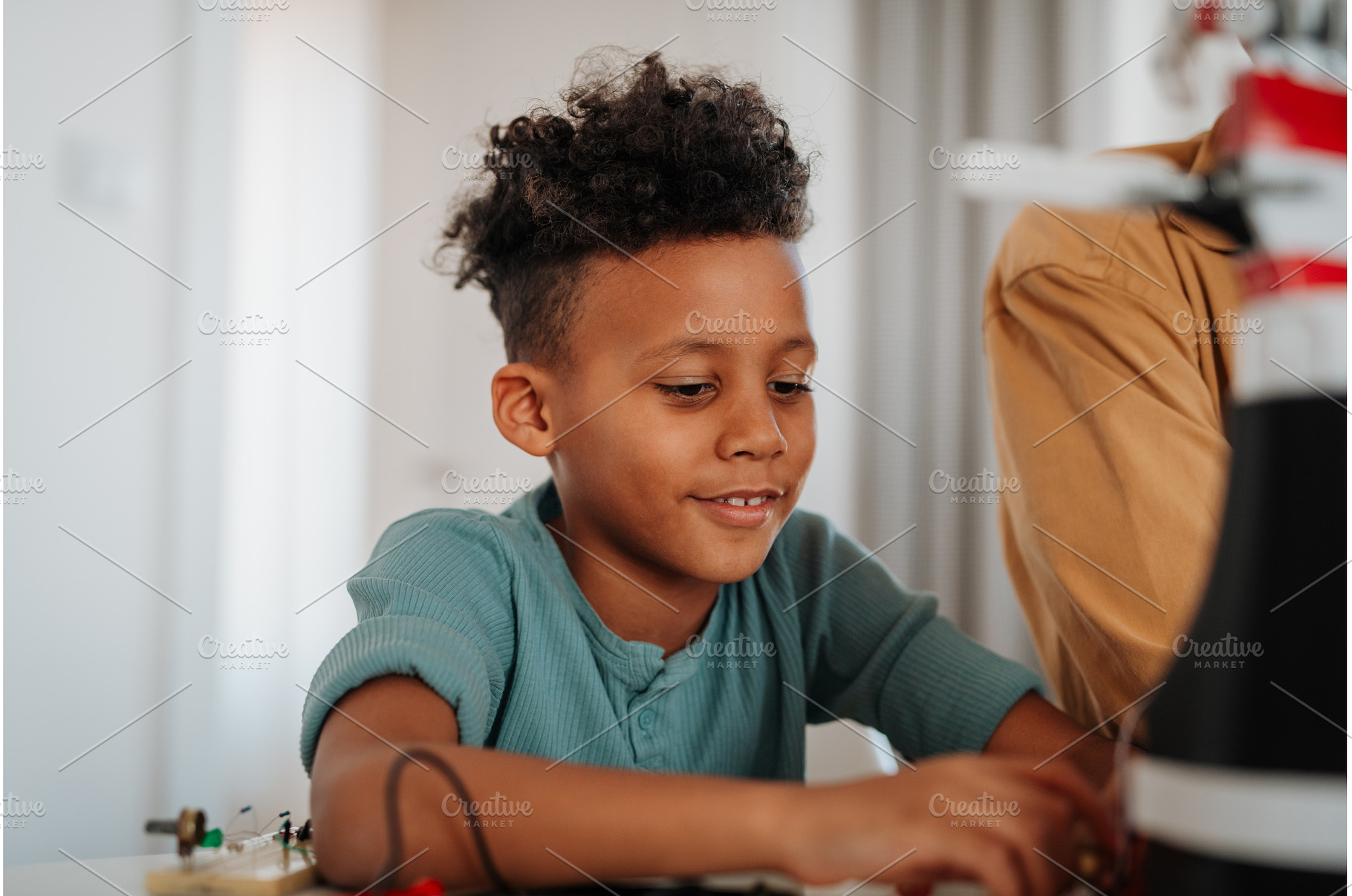 Father and son exploring STEM, a Technology Photo by HalfPoint