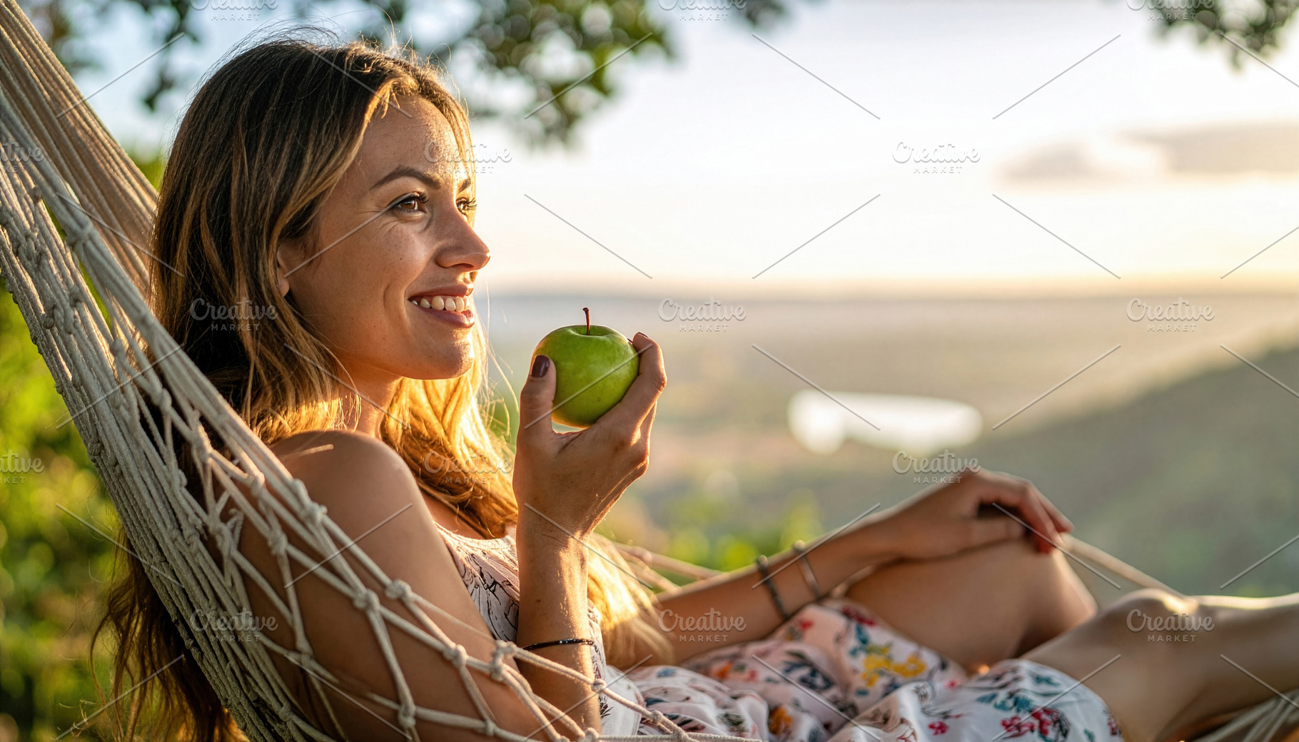 Smiling Woman Holding Green Apple in Hammock, a Photo by Davizro's Market
