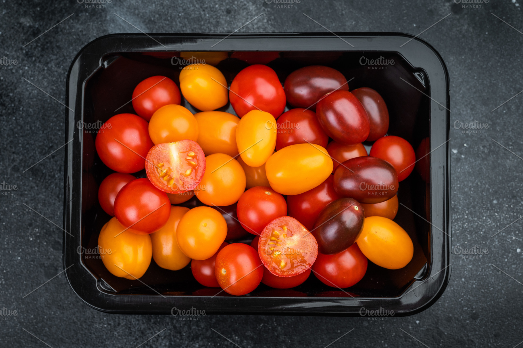 Fresh organic cherry tomatoes arranged in a retail style contain, a Food & Drink Photo by composter-box@mail.ru