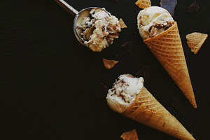 Chocolate ice cream in a sugar waffle cones stock photo containing ice and