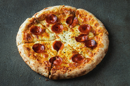 A slice of hot Italian pizza with stretching cheese. Pizza pepperoni on a dark, a Food & Drink Photo by Budarinphoto