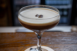 Espresso martini with a creamy foam layer, a Photo by Grafvision photography