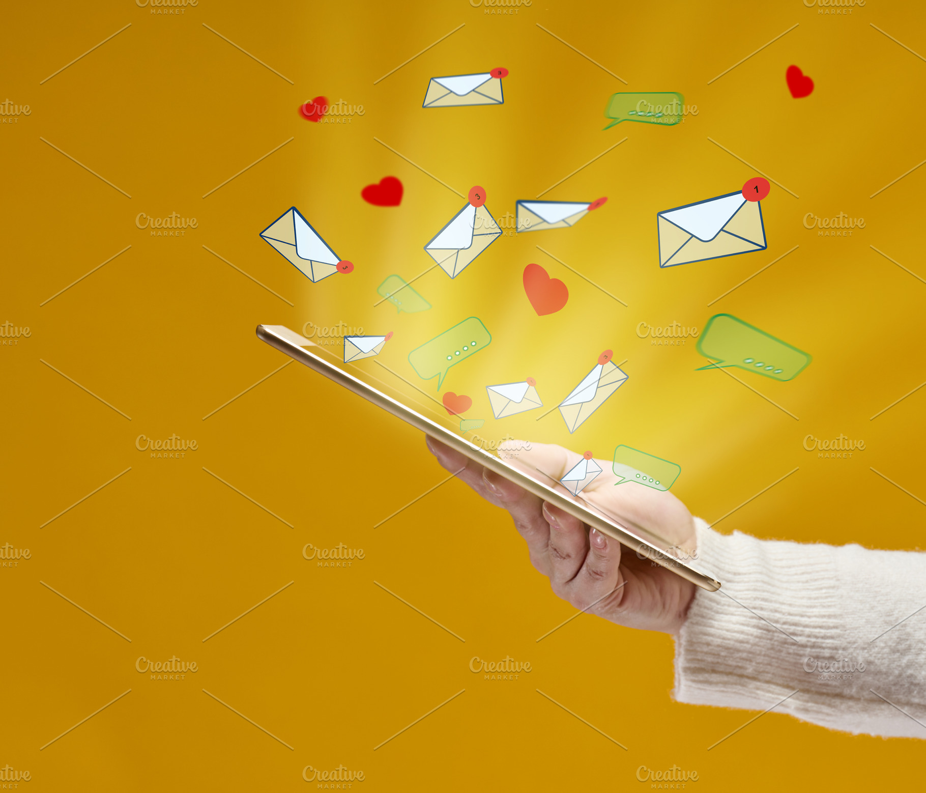 female hand holds a tablet with flying out hearts, dialogues and, a Technology Photo by ndanko