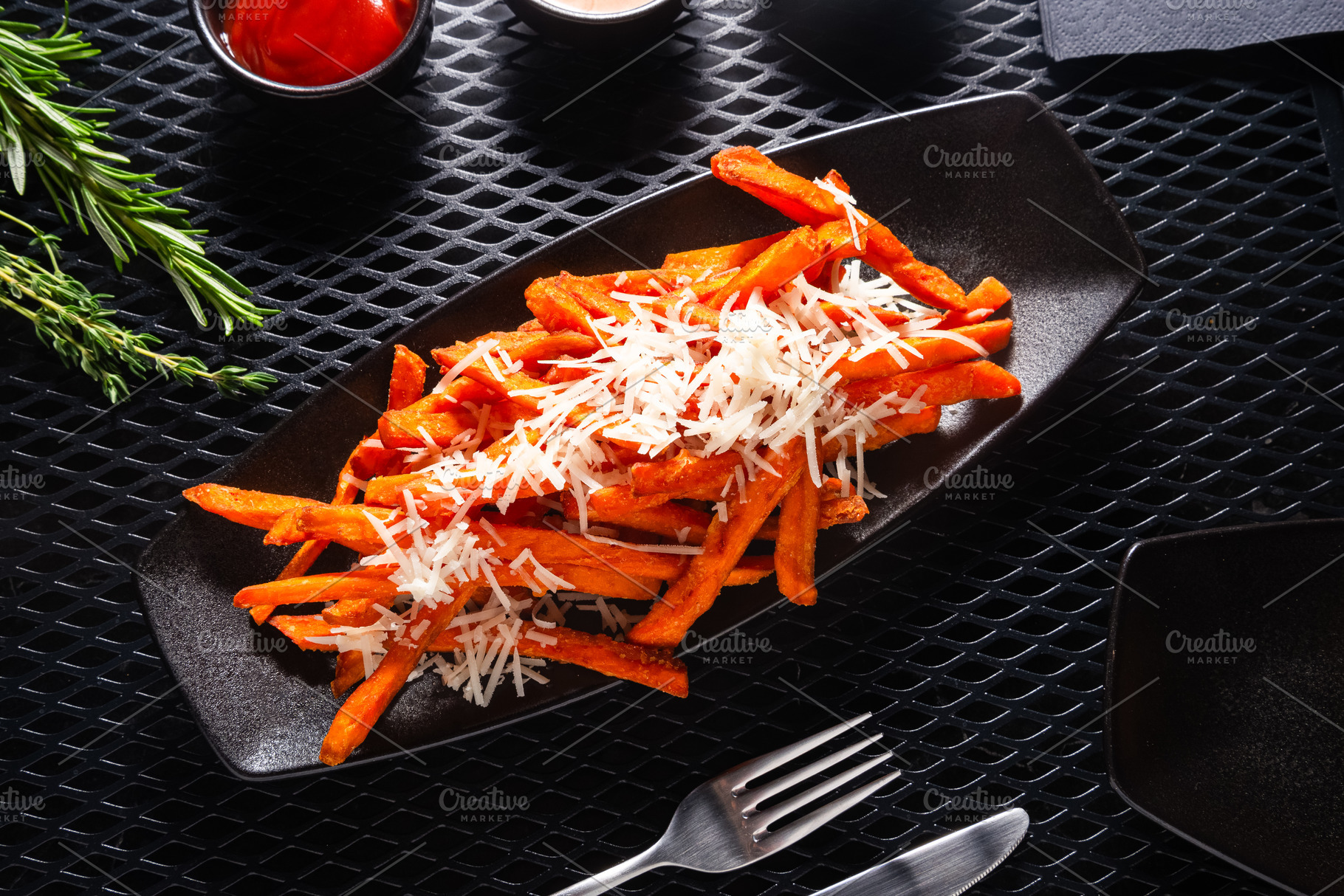Sweet Potato Fries in Black Plate on Dark Table, Top View, a Photo by MDBildes