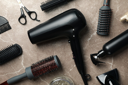 Composition with hairdresser accessories on gray background, top, a Beauty & Fashion Photo by AtlasStudio PRO