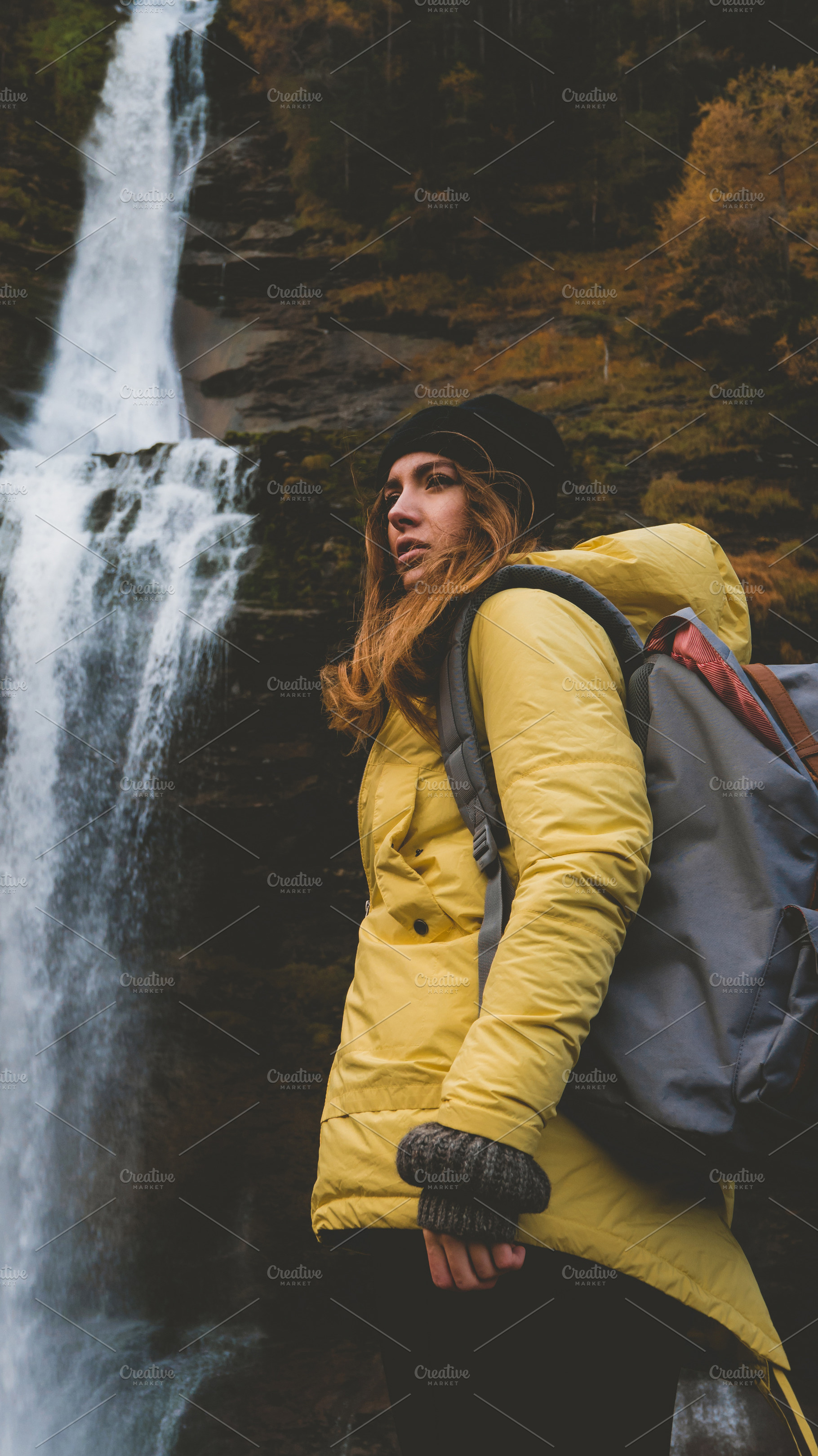 Hiker enjoys waterfall view stock photo containing nature and explore, a Person Photo by supamotion