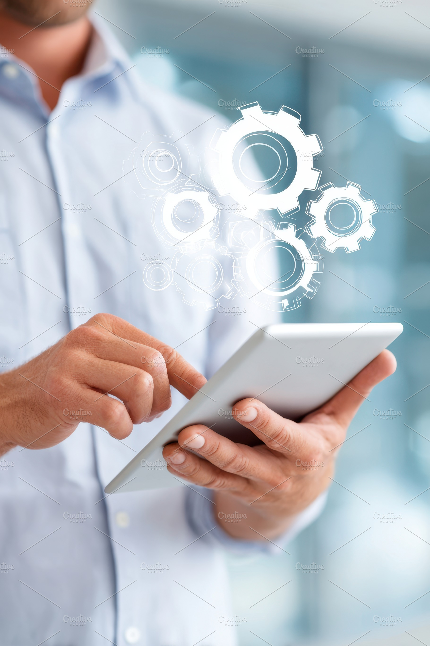 Digital Innovation with Tablet and Gears Overlay, a Business Photo by AlyaAnd