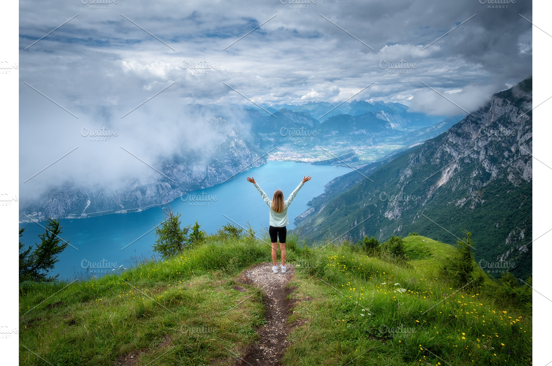 Young woman on the trail on mountain, a Person Photo by den-belitsky