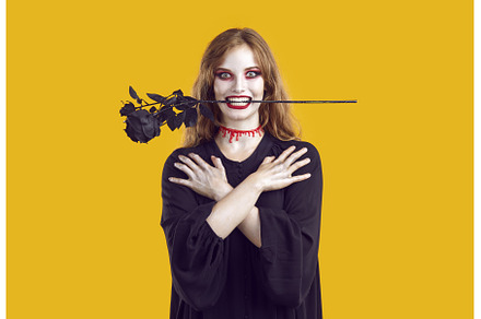 Smiling scary woman with black rose, a Person Photo by StudioRomantic