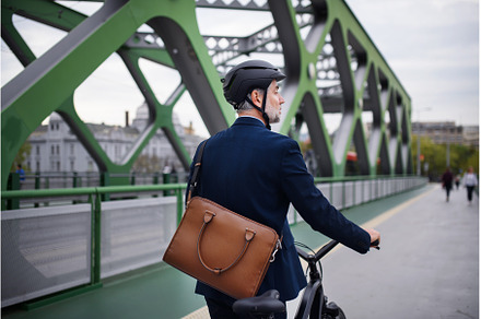 Businessman commuter on the way to, a Person Photo by HalfPoint