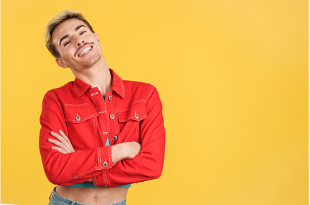 Cheerful gay man posing with arms, a Person Photo by Iván Moreno STOCK PHOTO