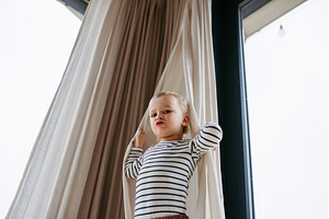 Adorable toddler boy playing hide, a Person Photo by HalfPoint
