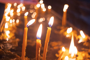 Burning church candles in dark temple with bokeh and copy space, a Photo by Pictures for you!!!!!!!!!