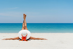 Woman in a sun hat relaxing, a Photo by rarrarorro