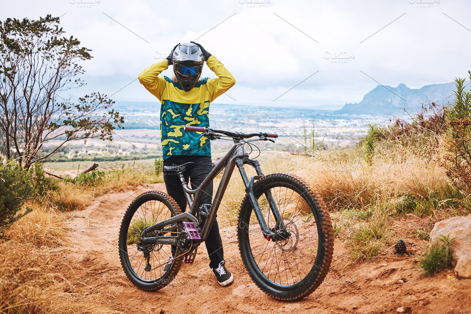 Mountain cyclist, bike and sports person on a outdoor nature road for a ride or sport race. Bicycle, fitness and workout training of an outdoors adventure athlete on a the mountains and dirt path, a Photo by Peopleimages.com