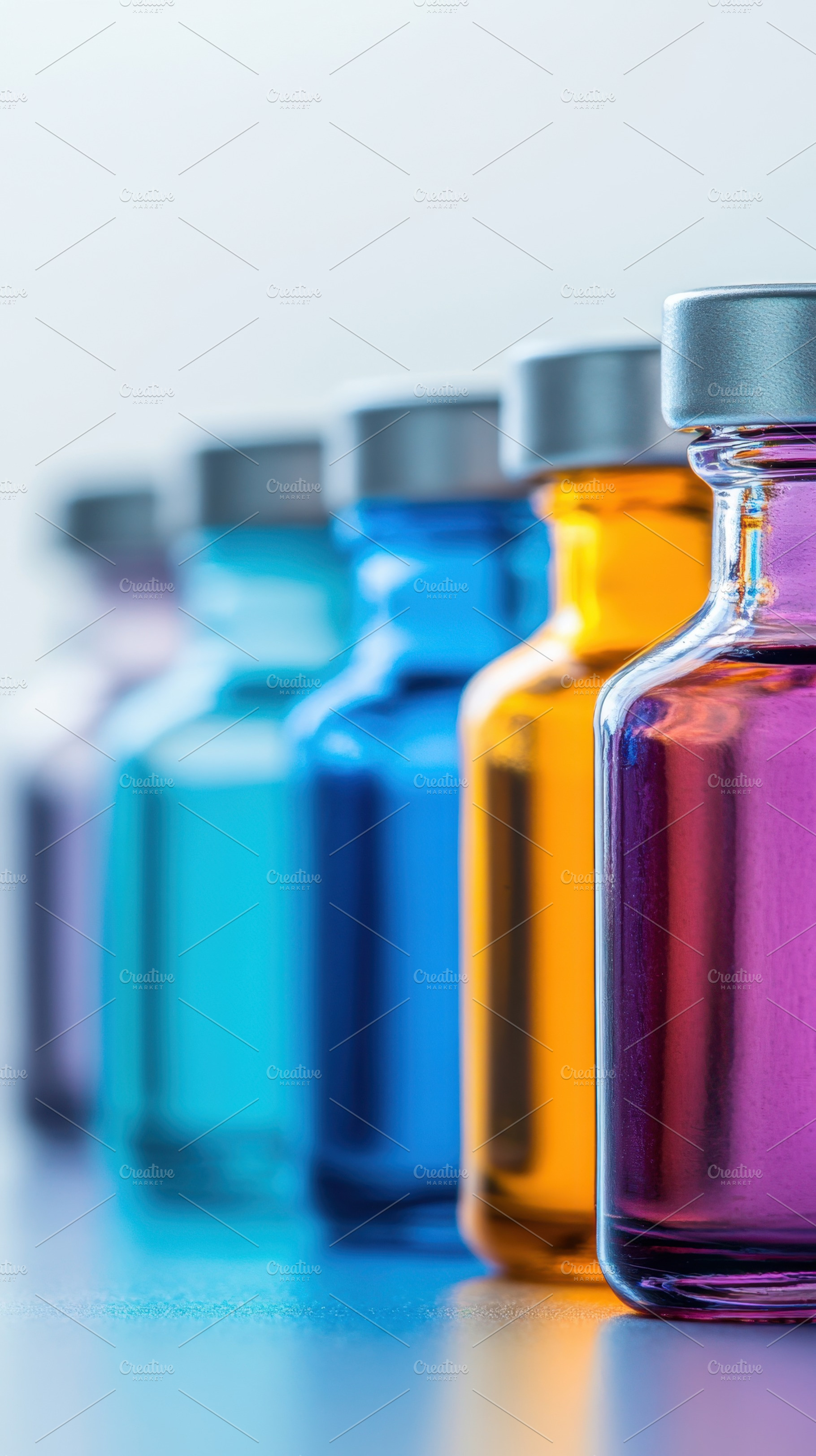 Row of colorful glass bottles, a Photo by Beautiful things