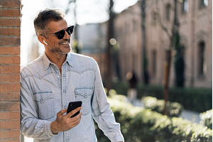 Business man listening to music in