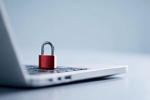 Padlock on laptop keyboard symbolizing security, a Technology Photo by AlyaAnd